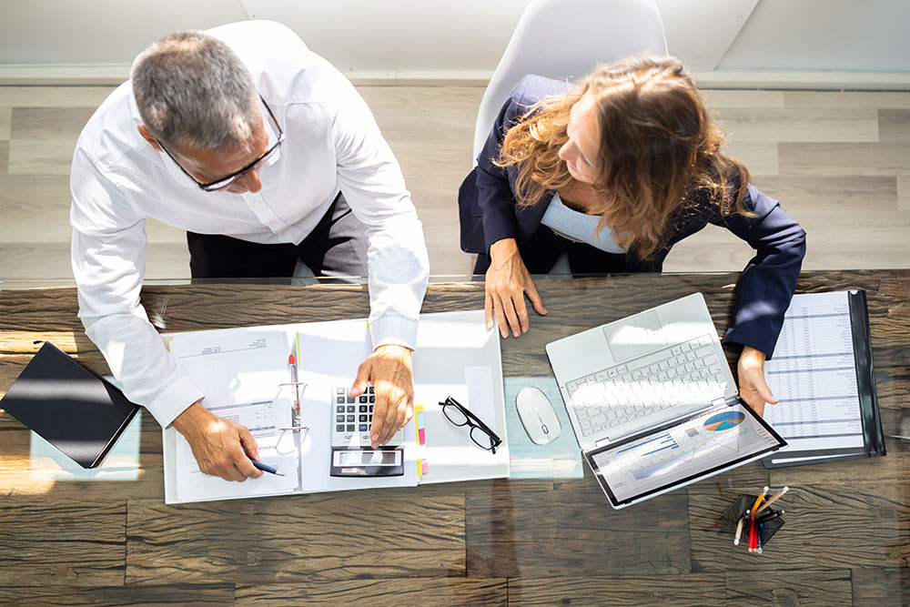 Accountants using laptop in office